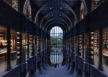 Listones de acero forman estantes esculturales en la librería Zhongshuge de Tianjin